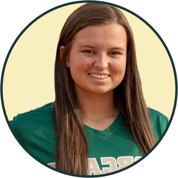 A female student athlete wearing a softball jersey